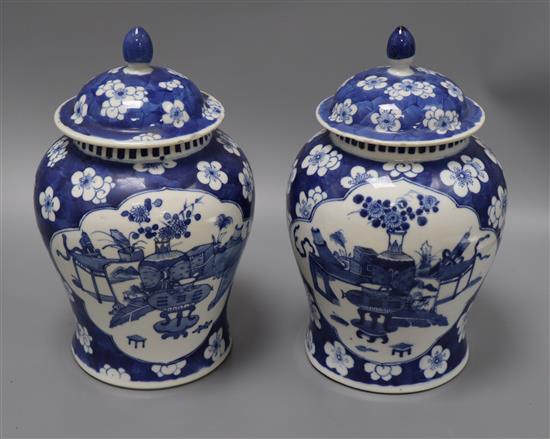 A pair of Chinese blue and white vases and covers height 28cm